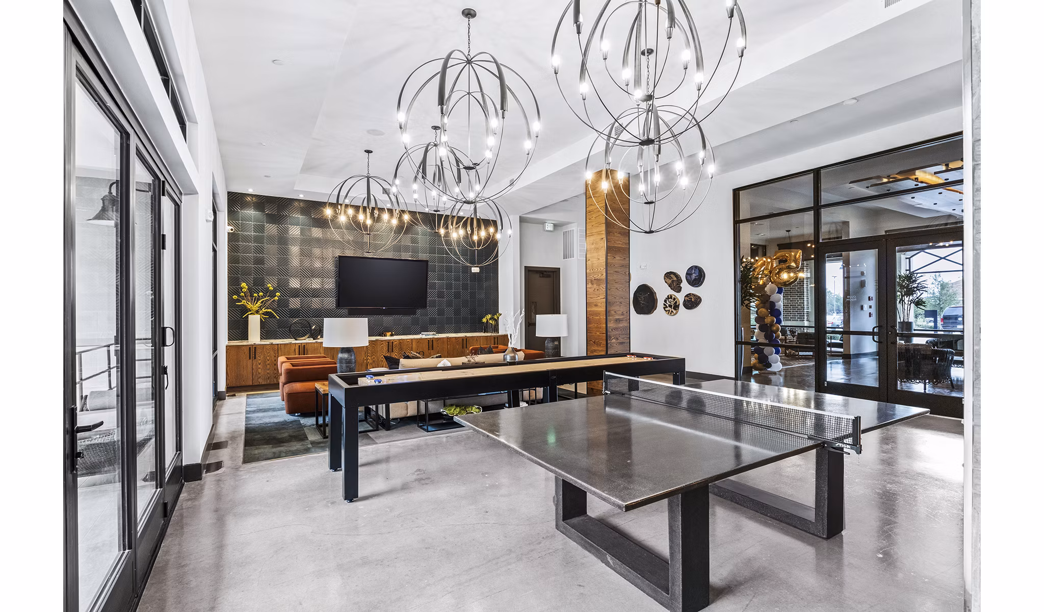 Elan Addison Grove Apartments: Modern clubhouse game room with pool table and lounge area