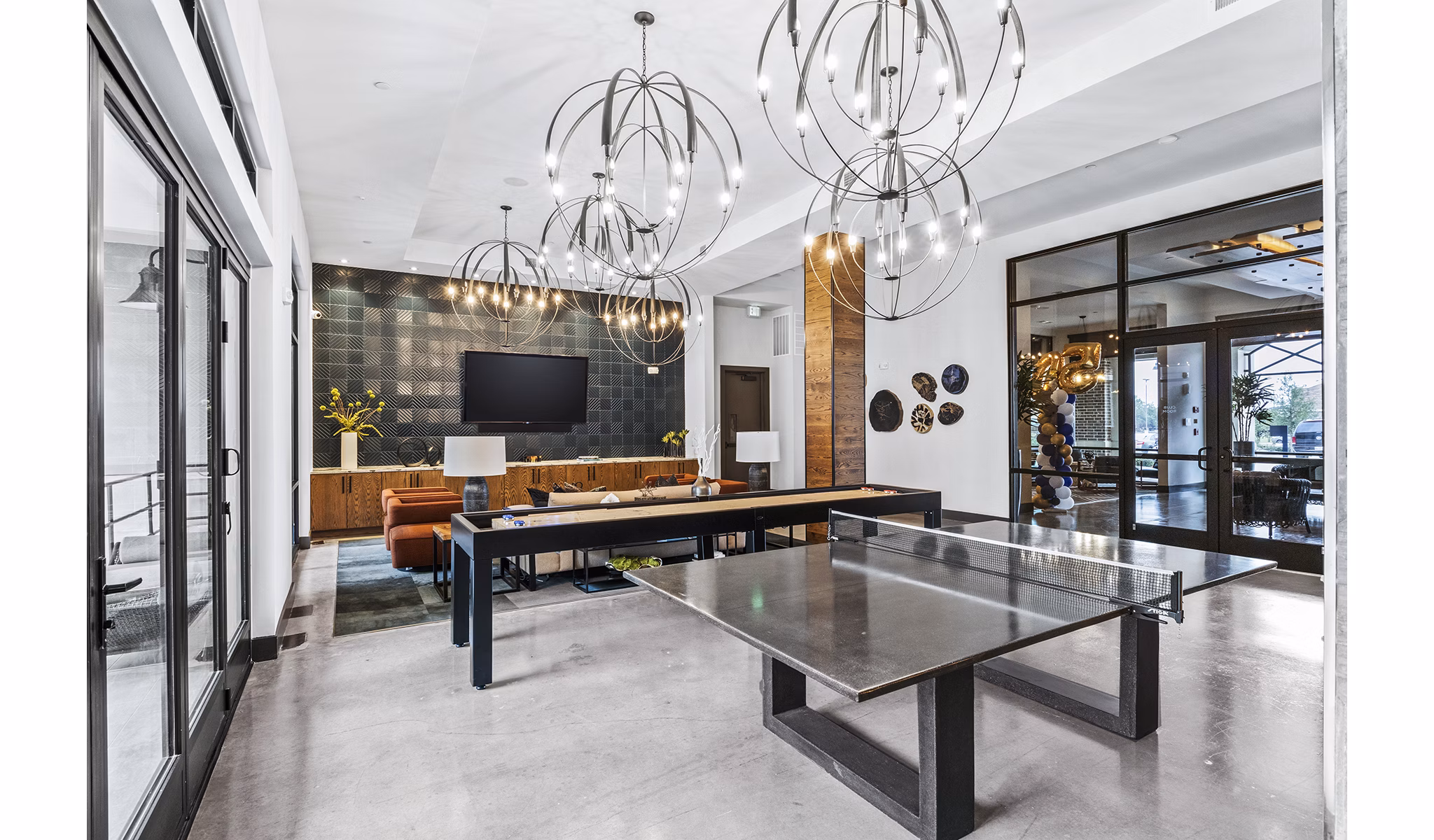 Elan Addison Grove Apartments: Modern clubhouse game room with pool table and lounge area
