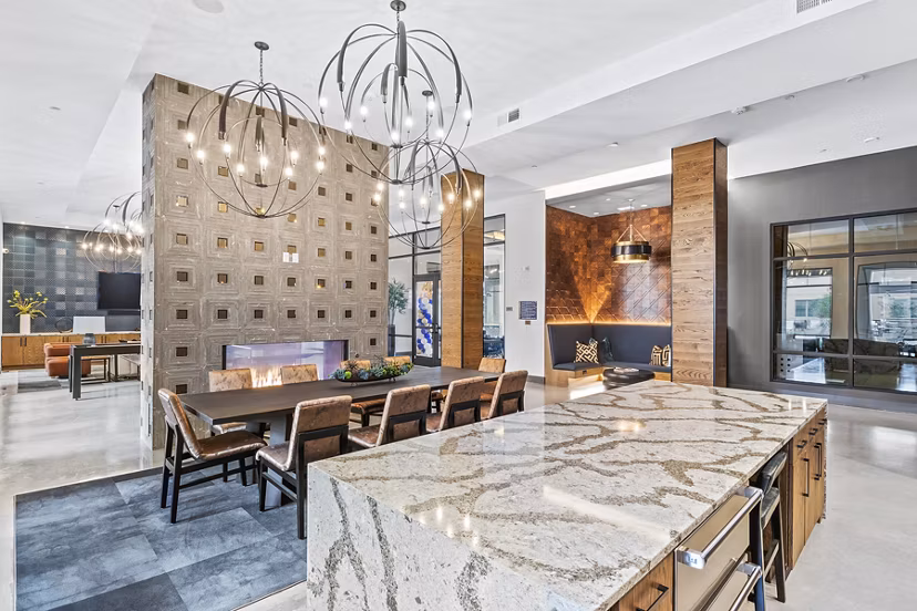 Modern clubhouse and lobby with elegant seating in Elan Addison Grove Apartments, perfect for social gatherings and relaxation