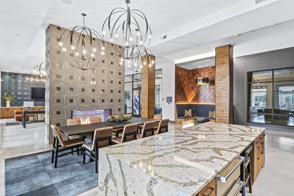 Modern clubhouse and lobby with elegant seating in Elan Addison Grove Apartments, perfect for social gatherings and relaxation