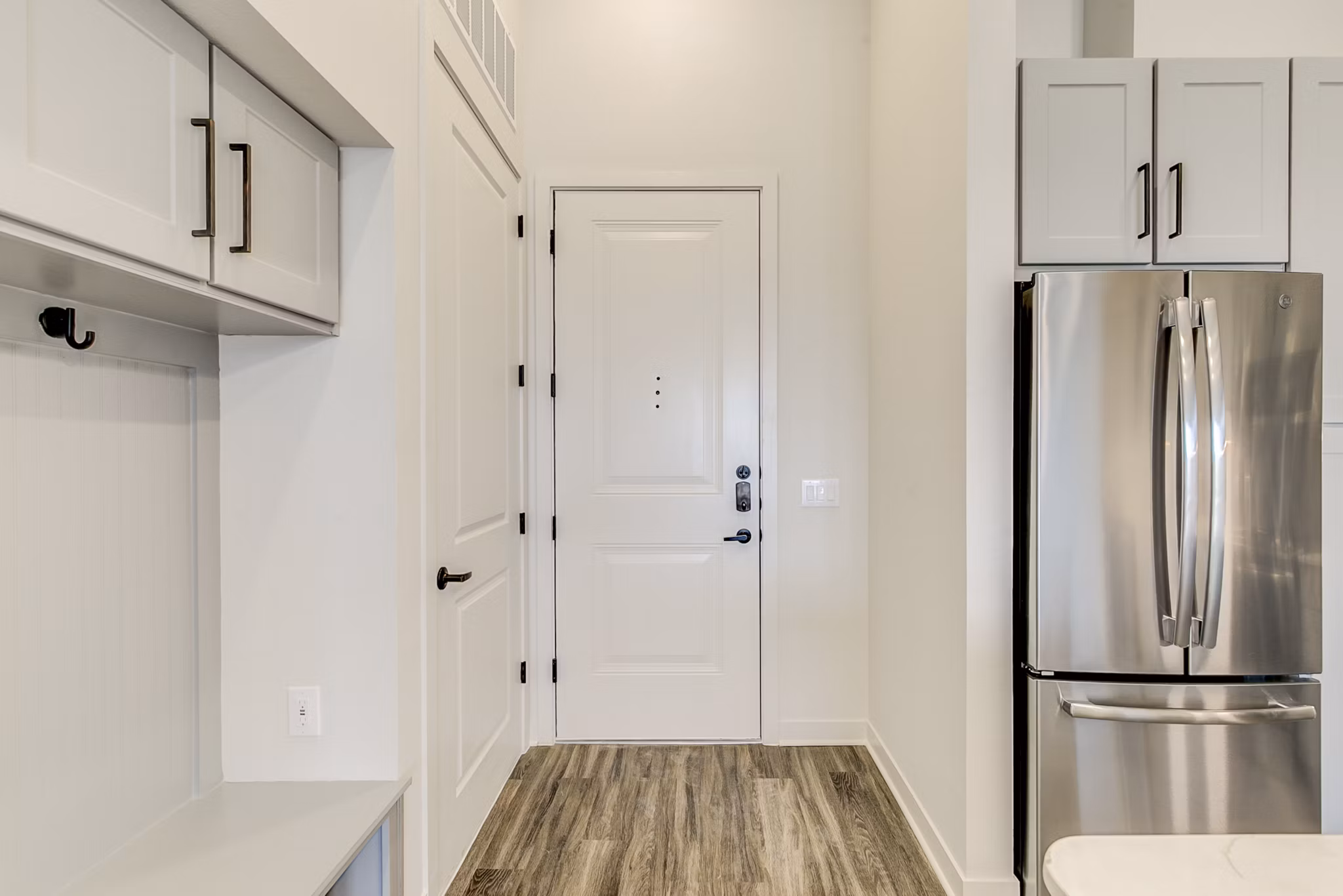 Modern kitchen with stainless steel appliances at Elan Addison Grove Apartments, ideal for luxury living