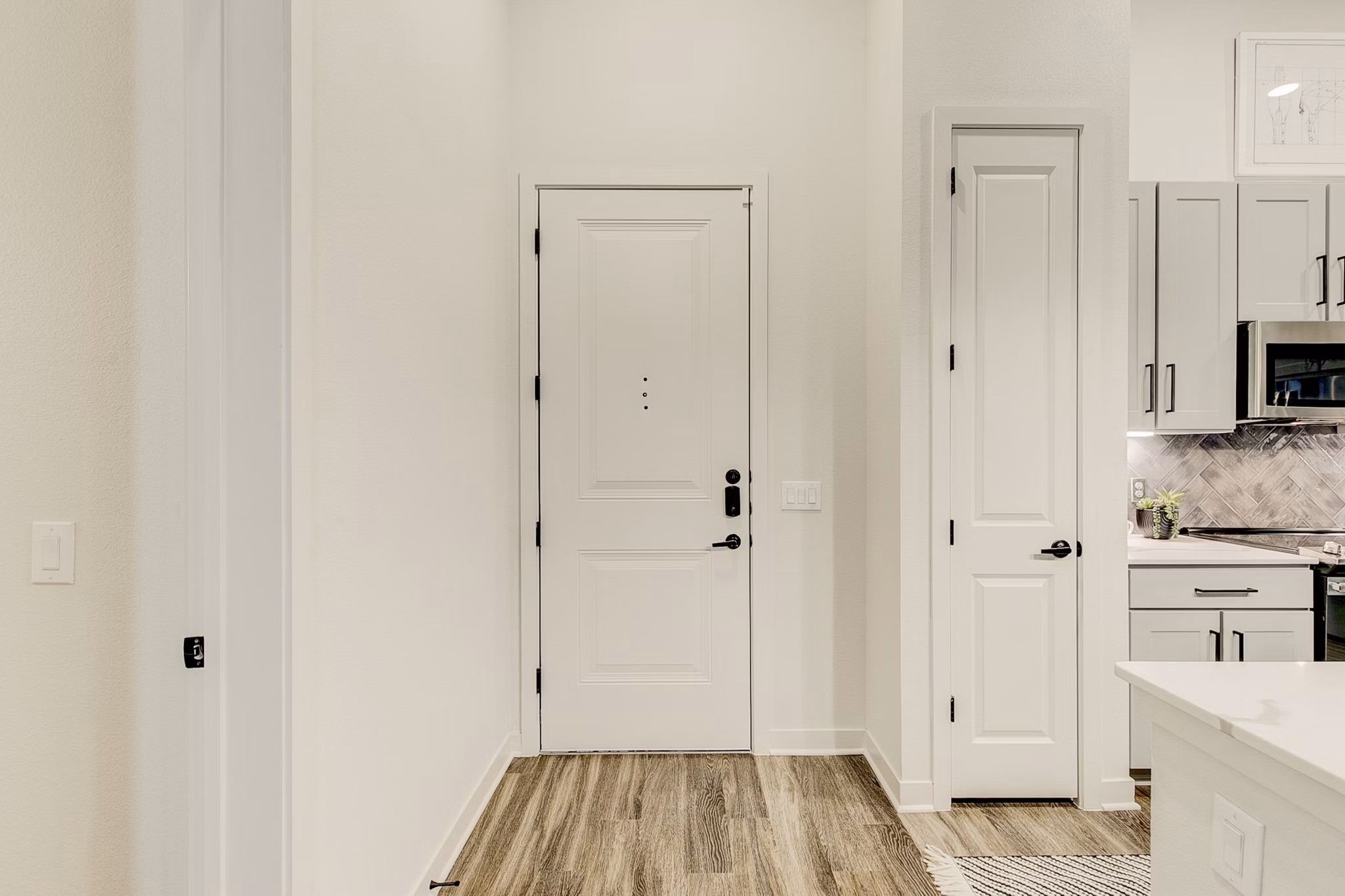 Modern kitchen with stainless steel appliances in Addison Grove Apartments