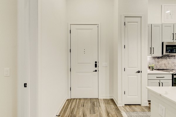 Modern kitchen with stainless steel appliances in Addison Grove Apartments