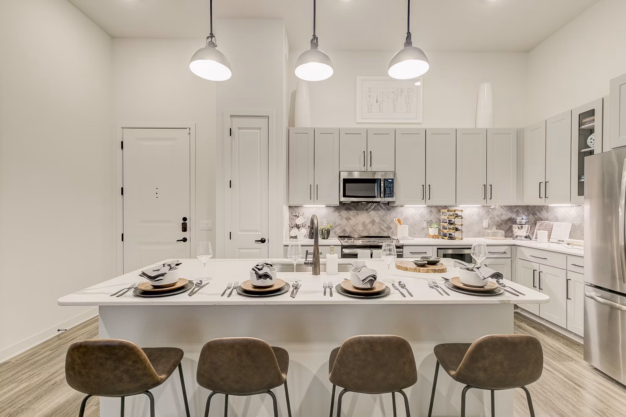 Addison Grove Apartments: Modern kitchen featuring stainless steel appliances and granite countertops