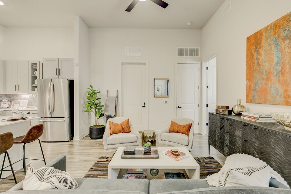 Contemporary living room with stylish furnishings at Addison Grove Apartments in a Greystar community