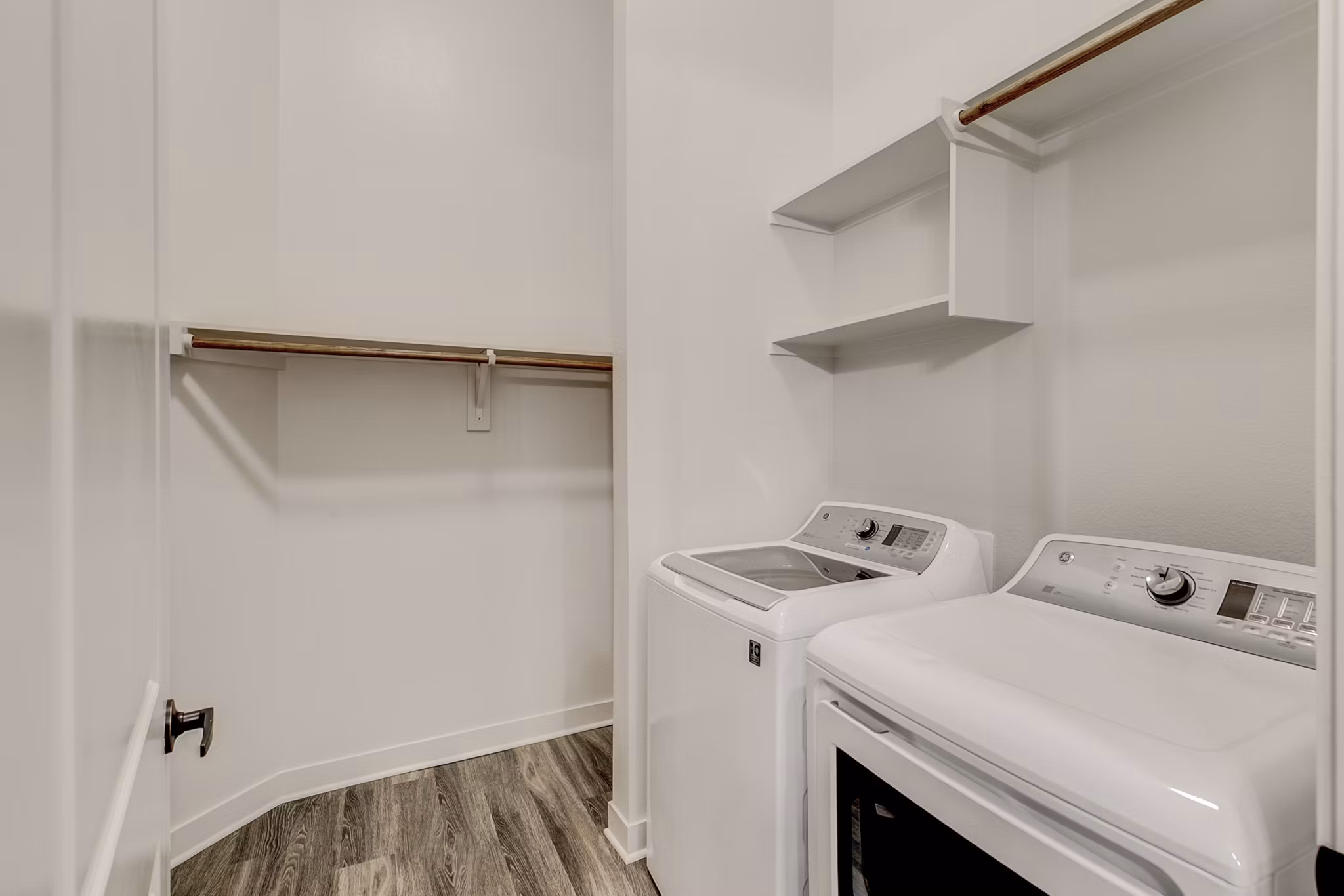 Laundry room with high-efficiency washers and dryers at Elan Addison Grove Apartments