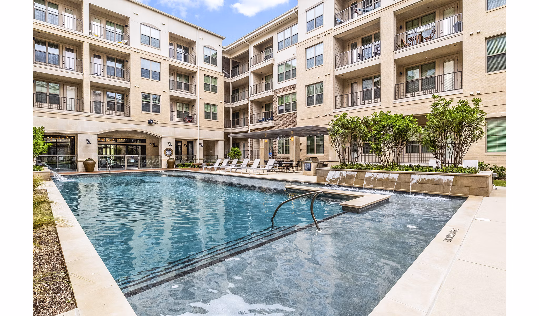 Luxurious outdoor pool at Elan Addison Grove Apartments, offering relaxation and style for residents