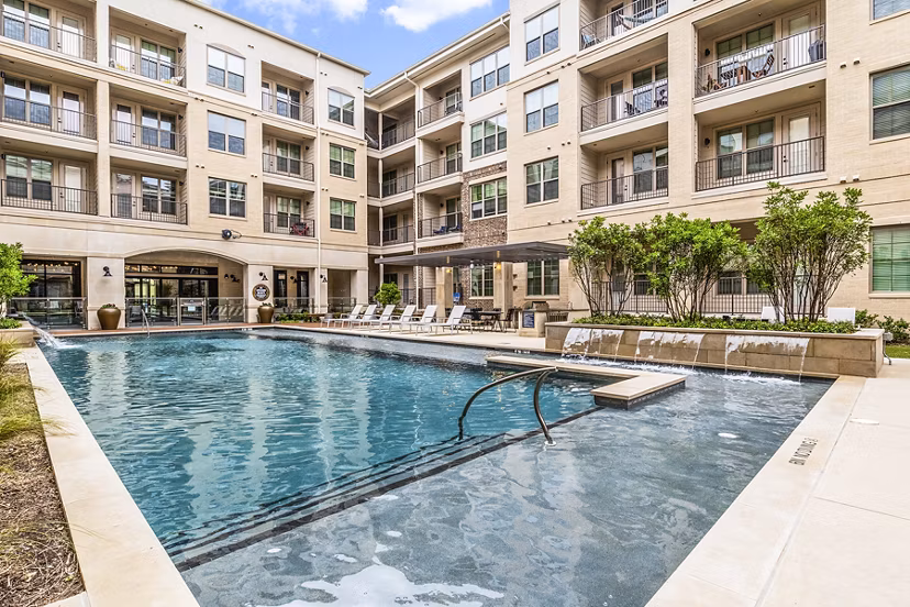 Luxurious outdoor pool at Elan Addison Grove Apartments, offering relaxation and style for residents