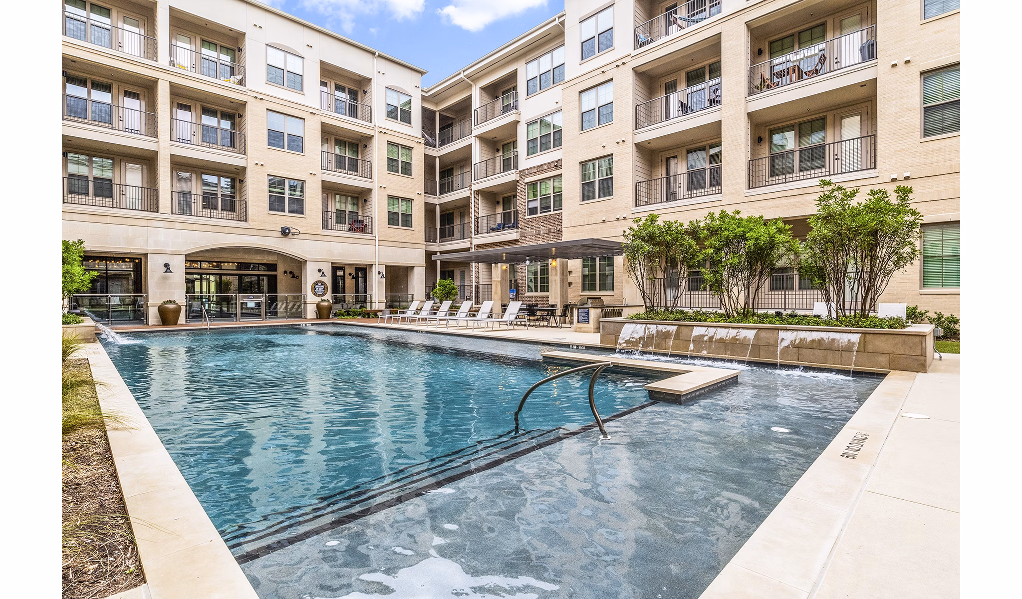 Luxurious outdoor pool at Elan Addison Grove Apartments, offering relaxation and style for residents