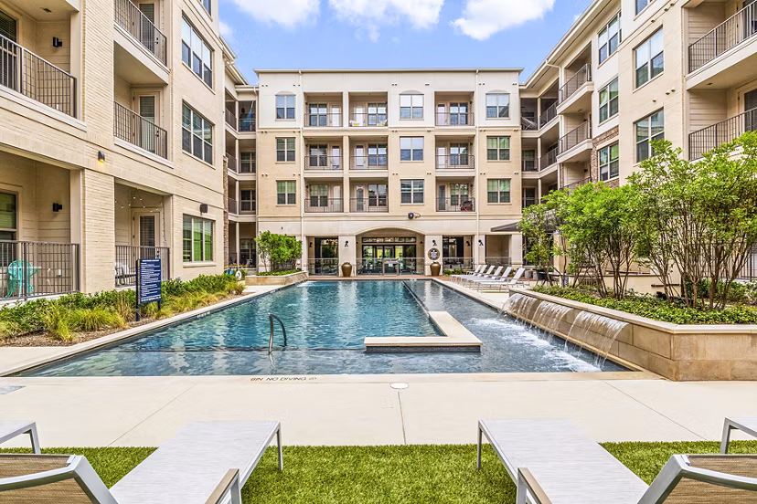 Chic poolside lounging at Elan Addison Grove Apartments with modern design and lush surroundings