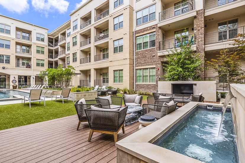 Spacious outdoor patio with modern furniture at Elan Addison Grove Apartments
