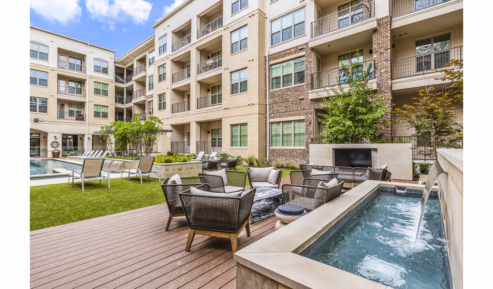 Spacious outdoor patio with modern furniture at Elan Addison Grove Apartments