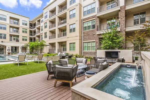 Spacious outdoor patio with modern furniture at Elan Addison Grove Apartments