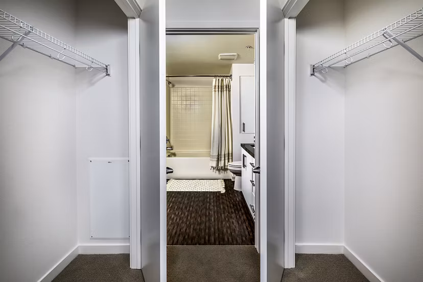 Modern bedroom closet with ample storage at Be DTLA Apartments