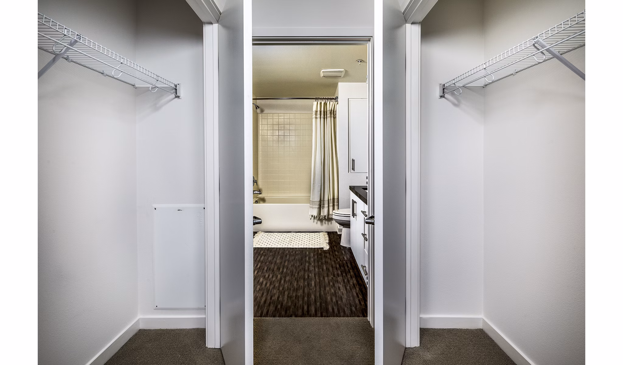 Modern bedroom closet with ample storage at Be DTLA Apartments