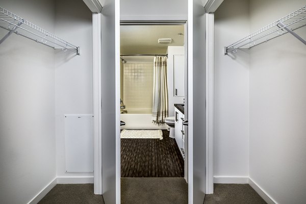 Modern bedroom closet with ample storage at Be DTLA Apartments