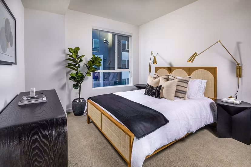 Contemporary bedroom with stylish furnishings at Be DTLA Apartments, offering luxury living in Los Angeles