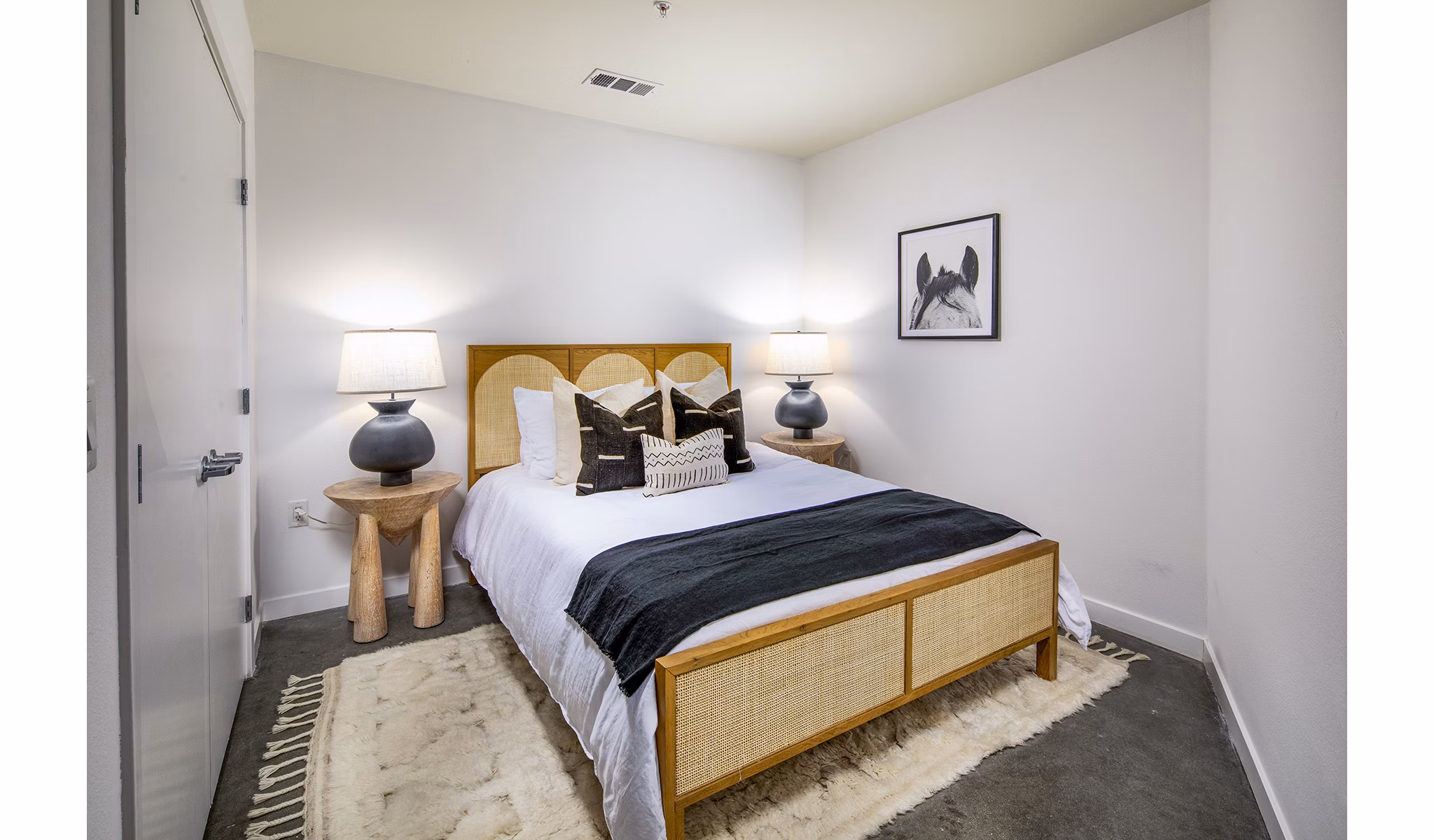 Stylish bedroom with city views at Be DTLA Apartments