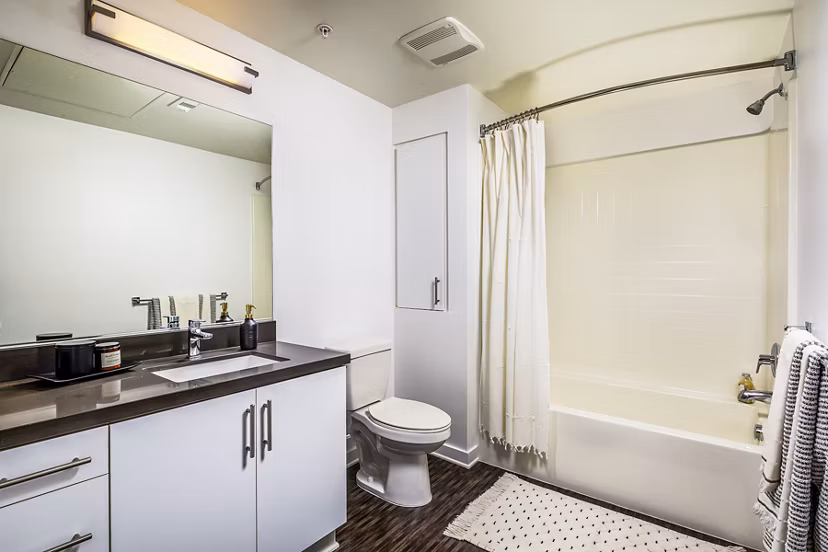 Modern bathroom featuring sleek fixtures at Be DTLA Apartments