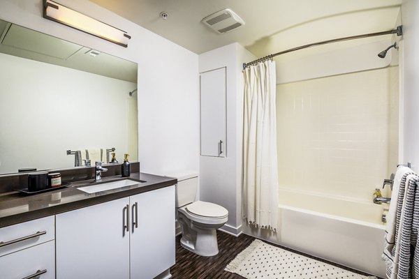 Modern bathroom featuring sleek fixtures at Be DTLA Apartments