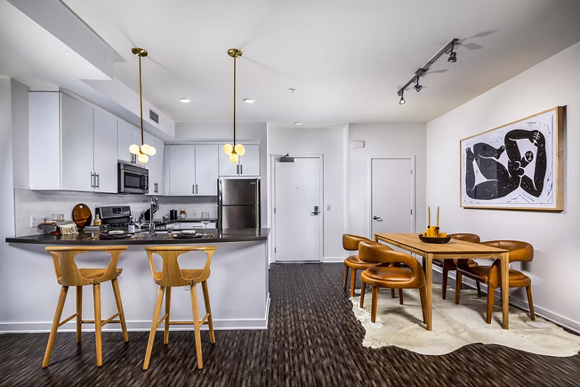 Dining area featuring modern decor and natural light at Be DTLA Apartments