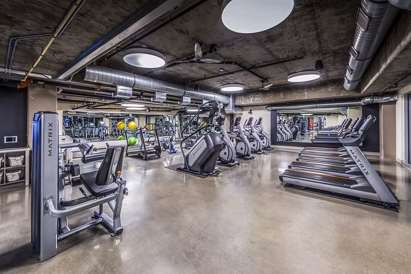 State-of-the-art fitness center with modern gym equipment at Be DTLA Apartments, supporting a healthy lifestyle