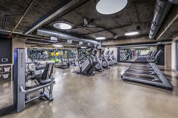 State-of-the-art fitness center with modern gym equipment at Be DTLA Apartments, supporting a healthy lifestyle