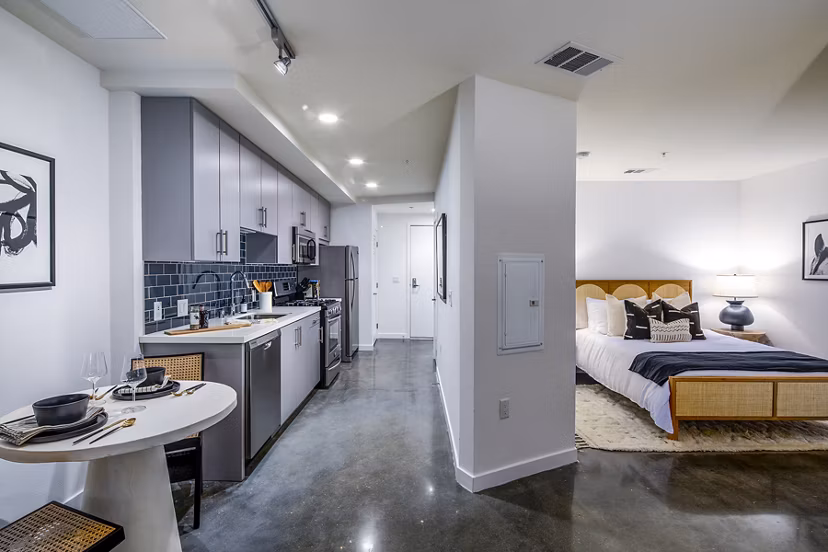 Elegant dining room with modern furnishings at Be DTLA Apartments offering luxury living in Los Angeles