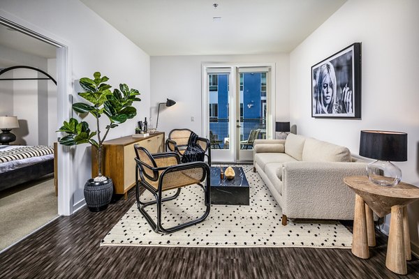 Contemporary living room with stylish decor at Be DTLA Apartments, featuring spacious layout and modern lighting in Los Angeles luxury apartments