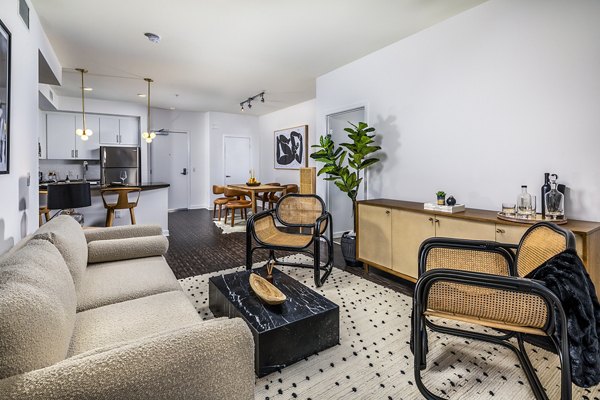 Modern living room with sleek decor in Be DTLA Apartments, offering luxurious comfort and style in downtown Los Angeles