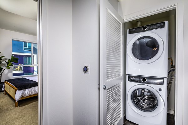 laundry room at Be DTLA Apartments