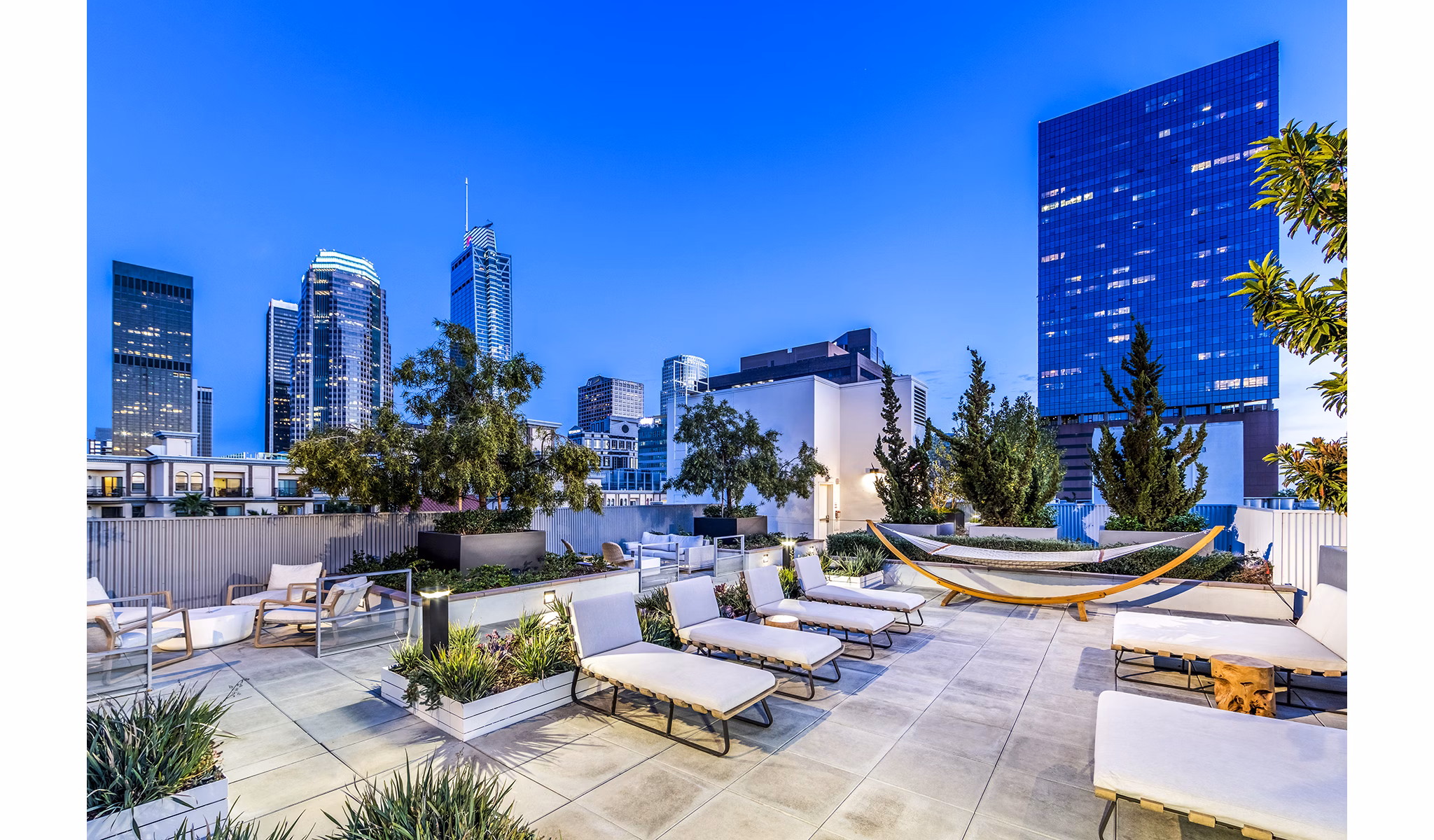 Patio area with stylish outdoor seating at Be DTLA Apartments