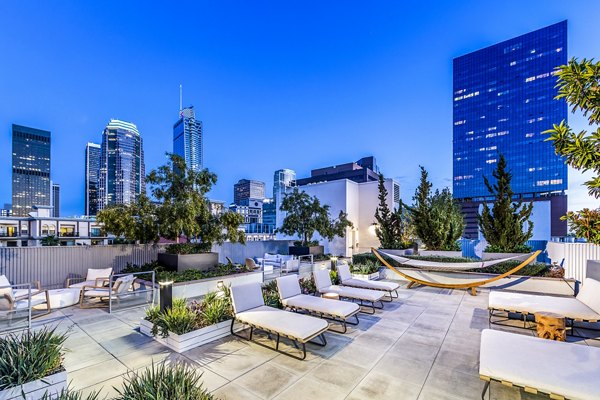Patio area with stylish outdoor seating at Be DTLA Apartments