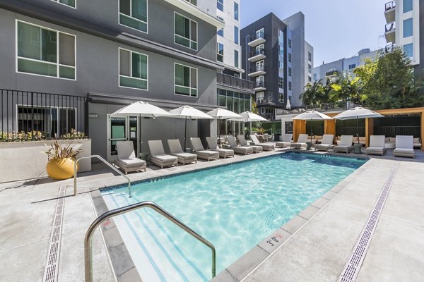 Poolside view at Be DTLA Apartments: Modern luxury apartments with a stunning swimming pool in the heart of downtown Los Angeles