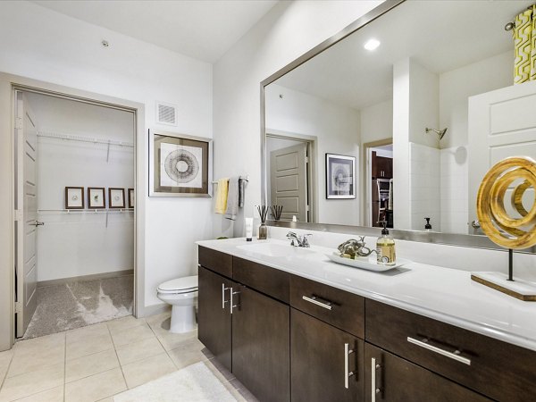 Modern bathroom with elegant fixtures at The Avery on Southwestern Apartments