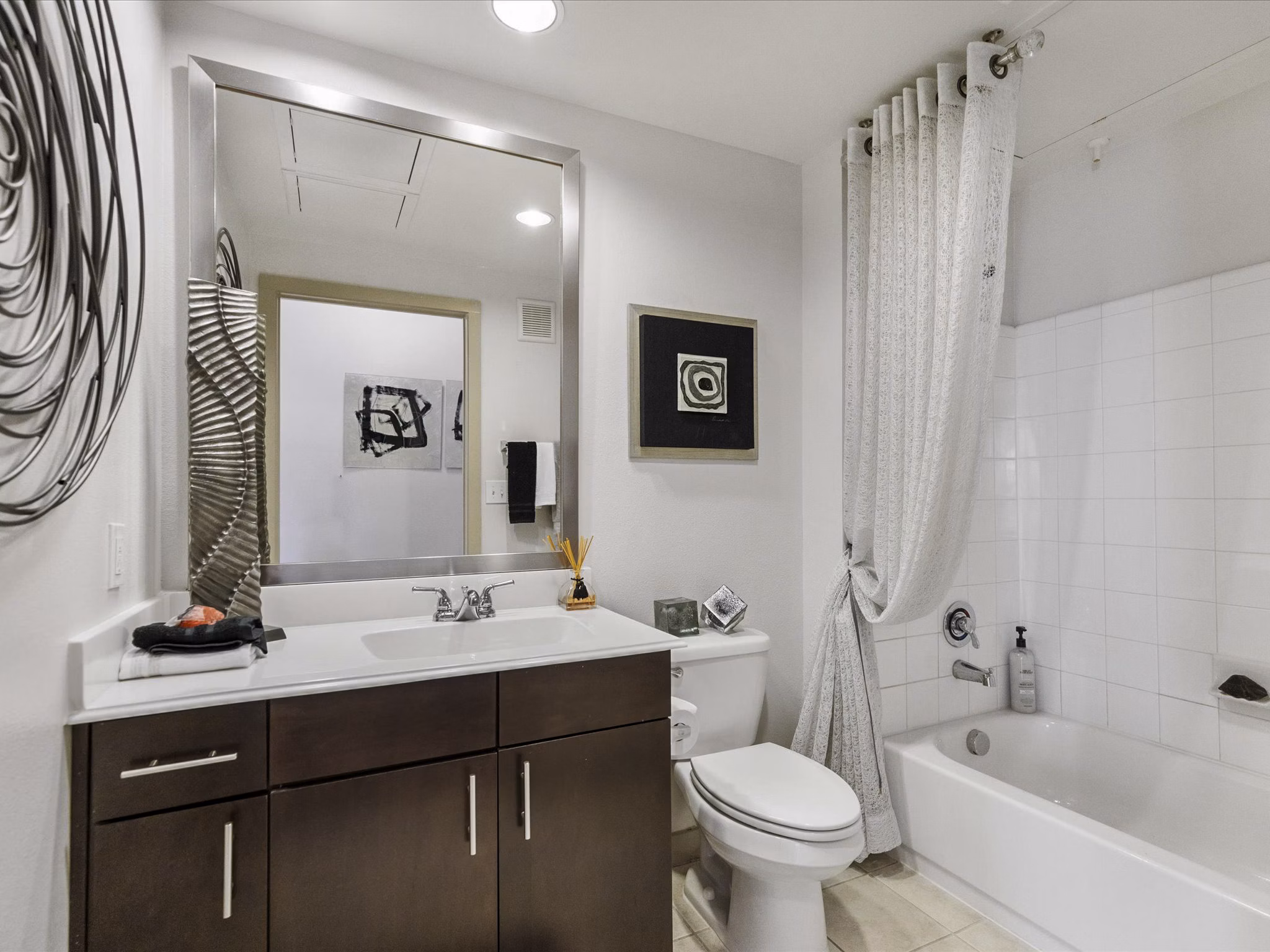 Luxurious bathroom with modern fixtures at The Avery on Southwestern Apartments, offering an elevated lifestyle in a prime location