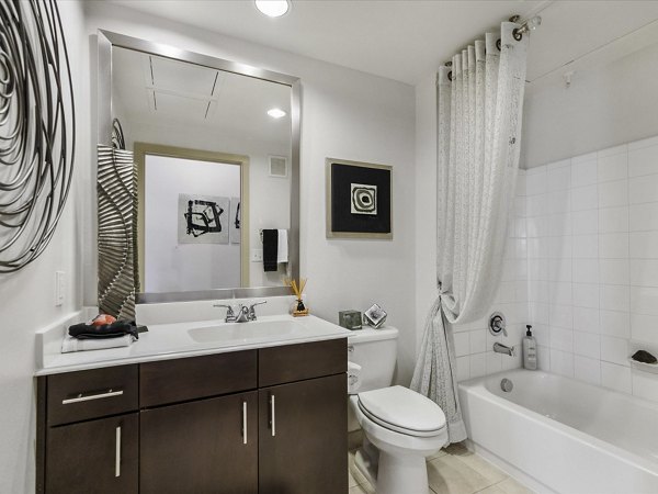 Luxurious bathroom with modern fixtures at The Avery on Southwestern Apartments, offering an elevated lifestyle in a prime location