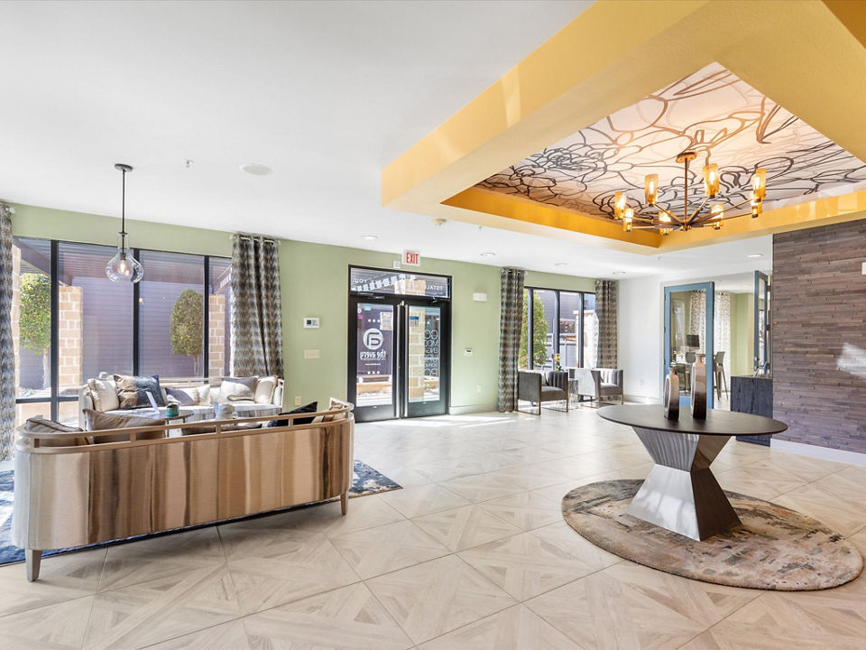 Modern clubhouse at The Avery on Southwestern Apartments featuring luxury lounge and entertainment spaces
