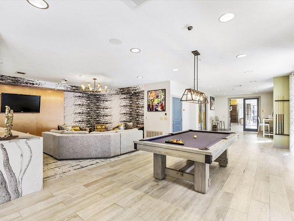 Clubhouse with modern seating and decor at The Avery on Southwestern Apartments