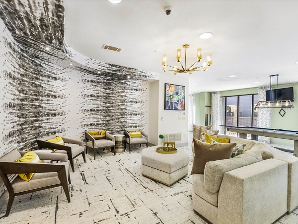 Modern clubhouse featuring luxury seating and decor at The Avery on Southwestern Apartments
