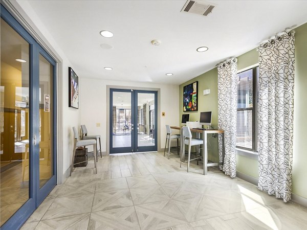 Clubhouse business center with modern amenities at The Avery on Southwestern Apartments