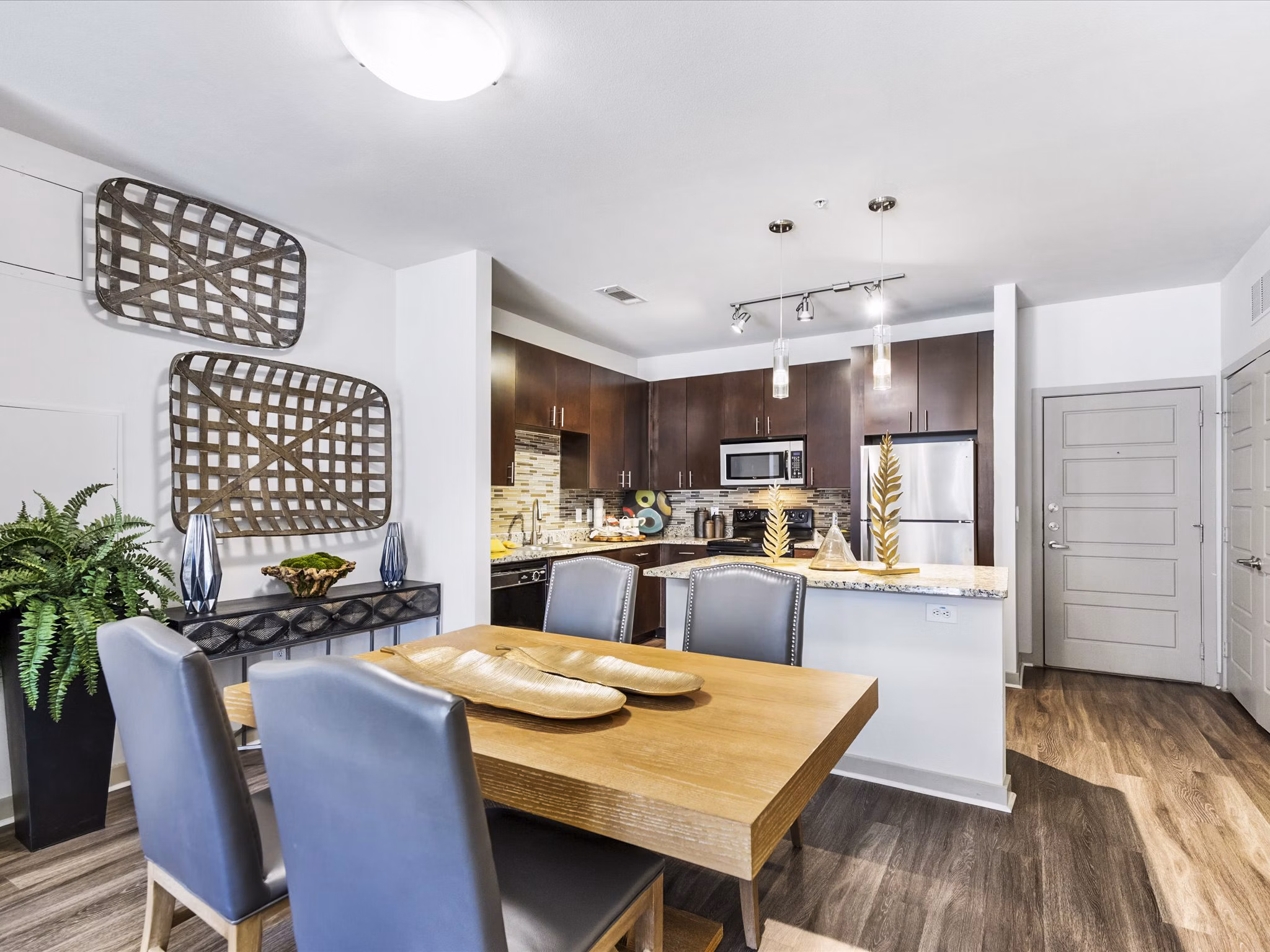 The Avery on Southwestern: Elegant dining room with modern decor and natural light, luxury apartments in the city