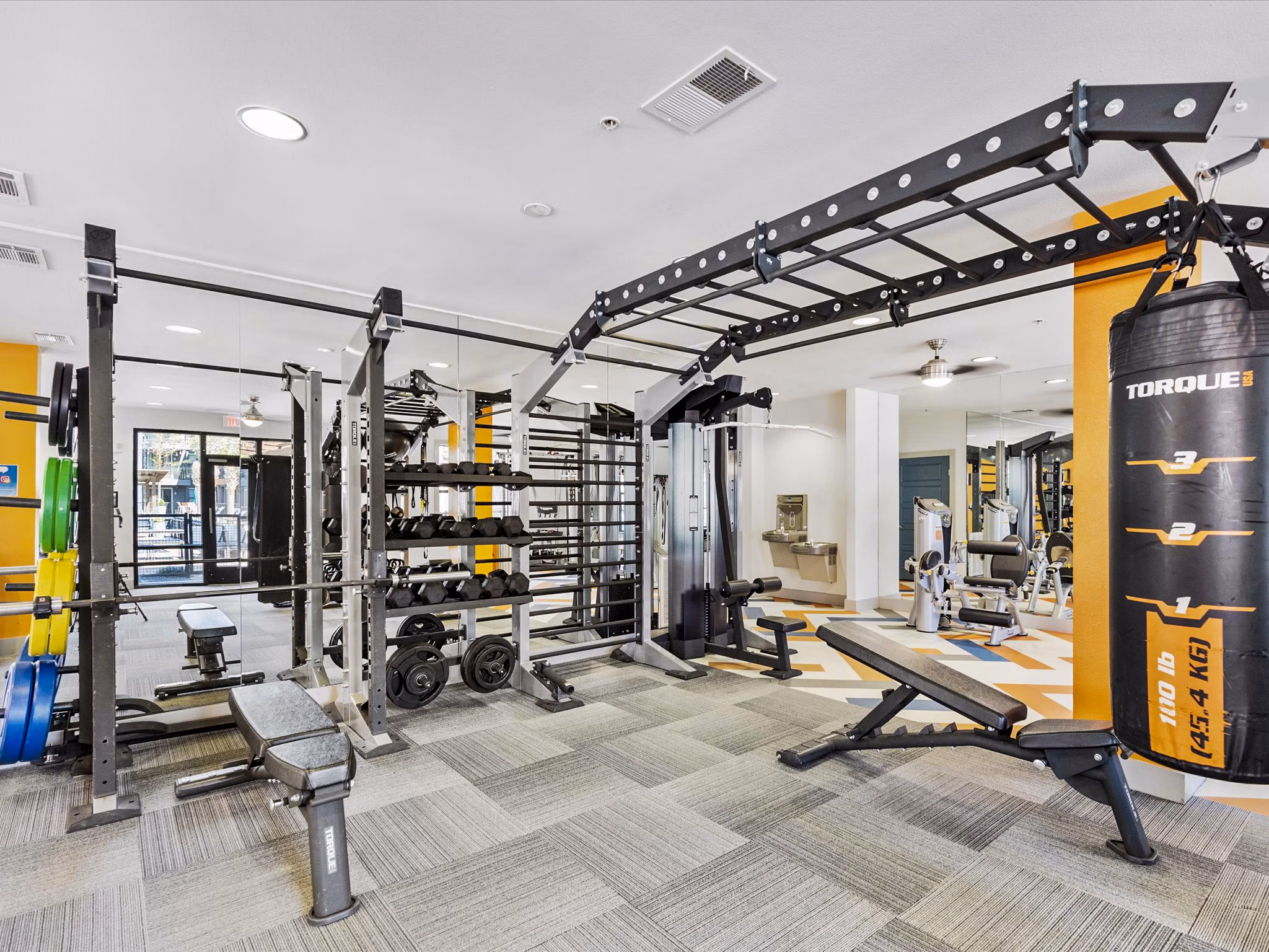State-of-the-art fitness center with modern equipment at The Avery on Southwestern Apartments, offering luxury living amenities