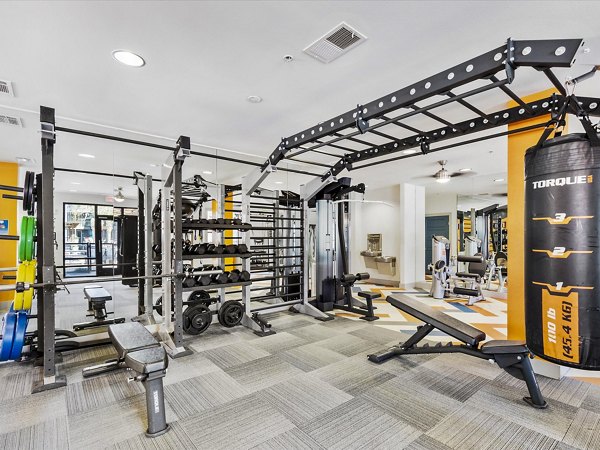 State-of-the-art fitness center with modern equipment at The Avery on Southwestern Apartments, offering luxury living amenities