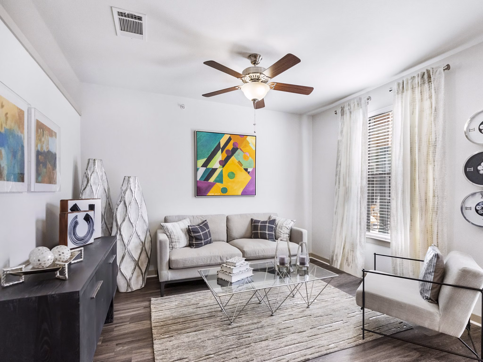 Spacious living room with modern decor in The Avery on Southwestern Apartments, perfect for relaxation and hosting activities