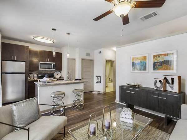 Spacious living room with modern decor at The Avery on Southwestern Apartments