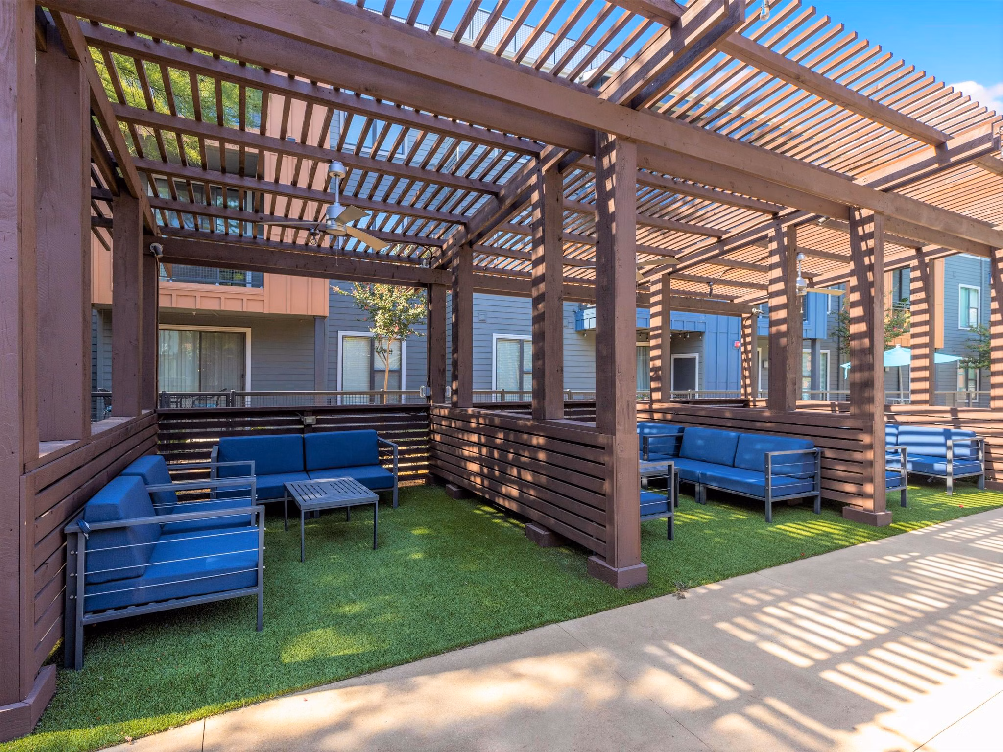 Courtyard with lush greenery and seating areas at The Avery on Southwestern Apartments Ideal outdoor space for relaxation and socializing