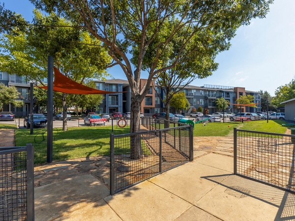 Dog park at The Avery on Southwestern Apartments: Spacious green area for pets and residents to enjoy outdoor activities