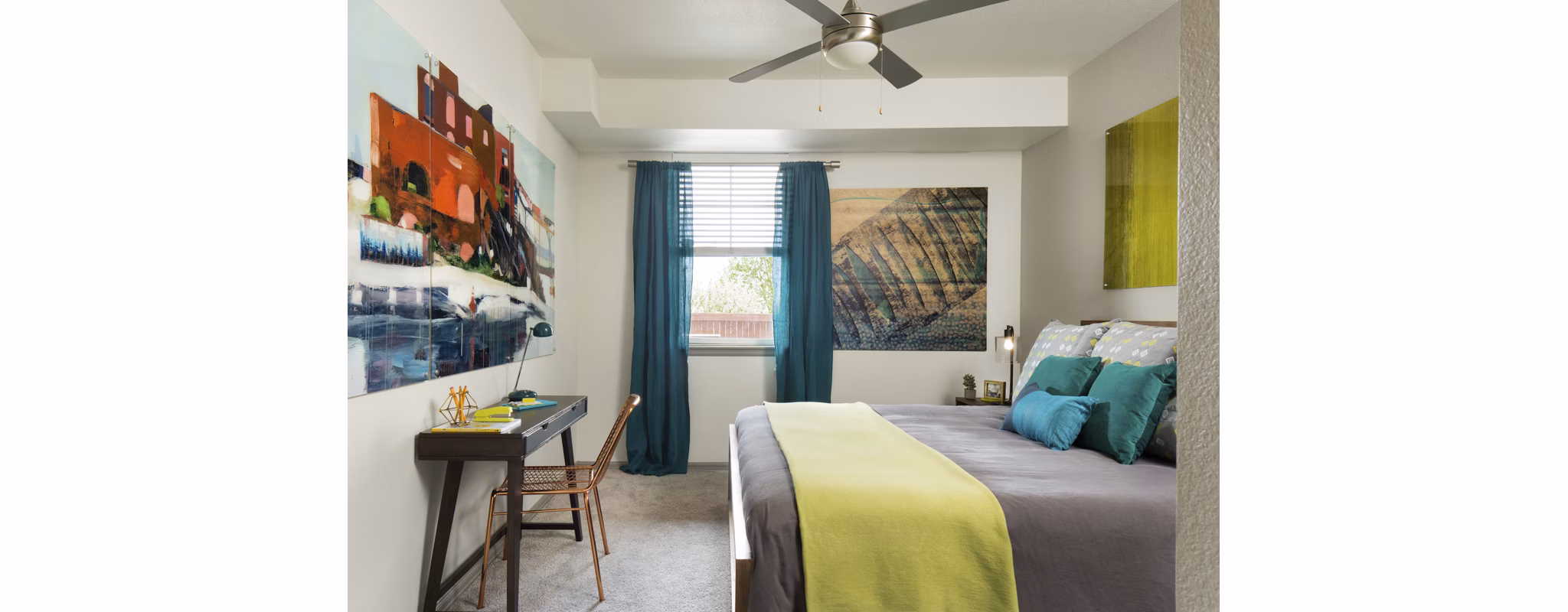 Cozy bedroom featuring modern decor in Griffis at Lowry Apartments, highlighting comfort and style for luxury living