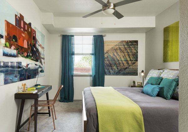 Cozy bedroom featuring modern decor in Griffis at Lowry Apartments, highlighting comfort and style for luxury living